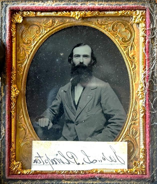 Ambrotype photo of James Plimpton wearing a suit and resting against one arm.